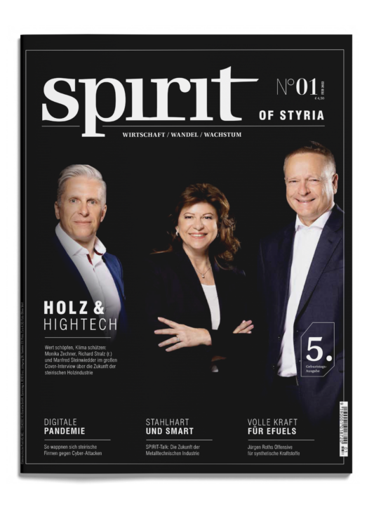 Drei professionell gekleidete Menschen stehen lächelnd auf dem Cover des Magazins "Spirit of Styria", Ausgabe 01/2021, mit Schlagzeilen aus der Wirtschaft.