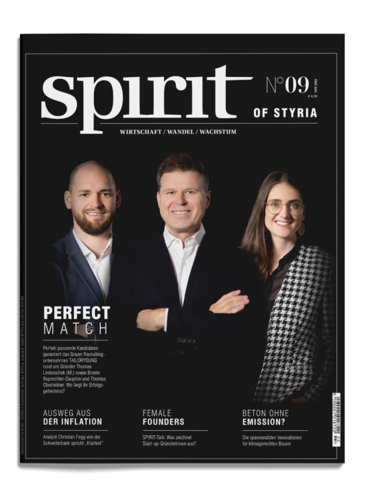 Drei professionell gekleidete Menschen stehen lächelnd auf dem Cover des Magazins "spirit of Styria", Ausgabe Nr. 09, mit deutschen Schlagzeilen daneben.