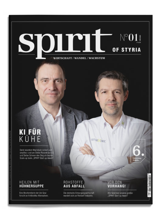 Zwei Männer in Business-Kleidung stehen nebeneinander auf dem Cover des Magazins "spirit of styria", das sich mit Themen aus Innovation und Industrie beschäftigt.