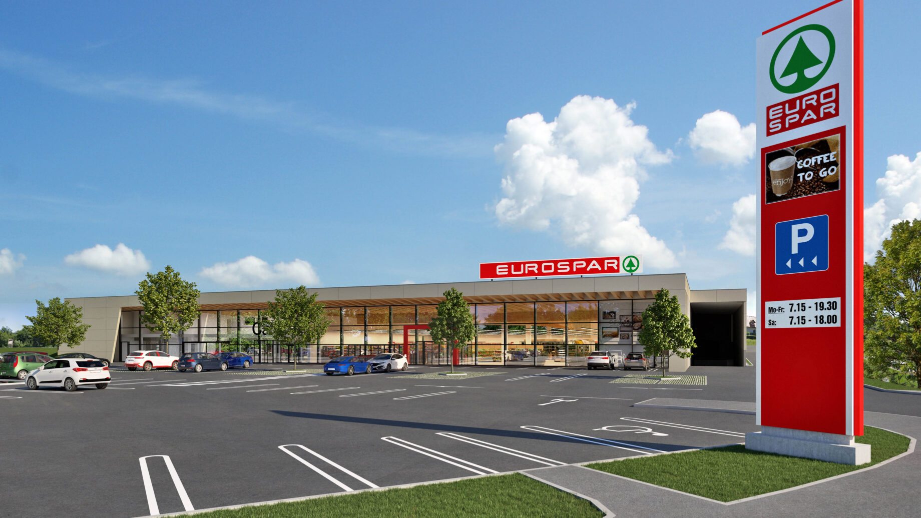 Ein moderner EUROSPAR-Supermarkt mit einer großen Glasfassade präsentiert nachhaltiges Bauen, einen größtenteils leeren Parkplatz, mehrere geparkte Autos, Bäume und ein hohes Schild mit dem Namen des Geschäfts und Parkinformationen unter einem blauen Himmel mit einigen Wolken.