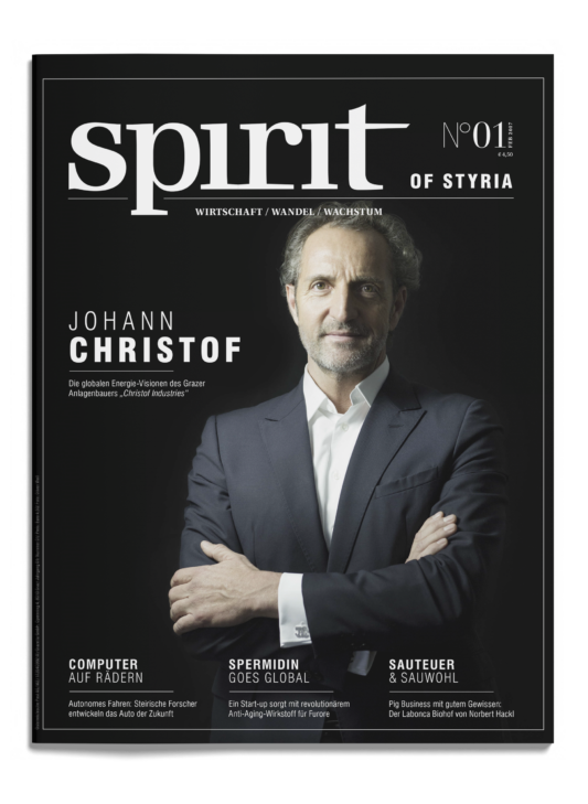 Titelbild des Magazins "spirit of styria" mit Johann Christof im Anzug, verschränkte Arme, um ihn herum Artikelüberschriften in deutscher Sprache.