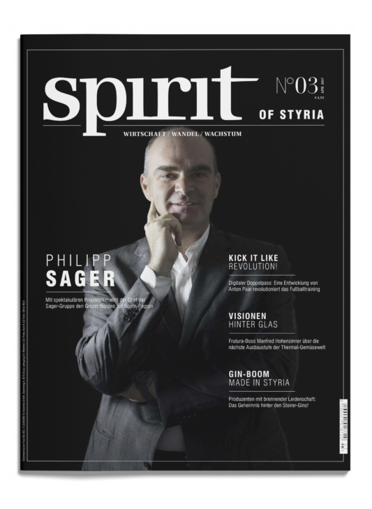 Ein Mann im Anzug posiert mit der Hand am Kinn auf dem Cover des Magazins spirit of Styria", Ausgabe Nr. 03, mit Wirtschaftsschlagzeilen.