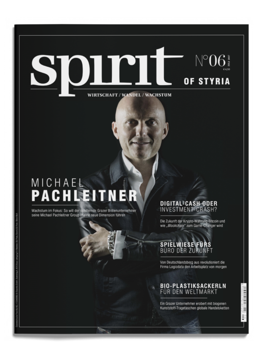 Das Titelbild einer Zeitschrift mit dem Titel "spirit of styria" zeigt Michael Pachleitner im Anzug, lächelnd und mit verschränkten Armen, vor einem schwarzen Hintergrund.