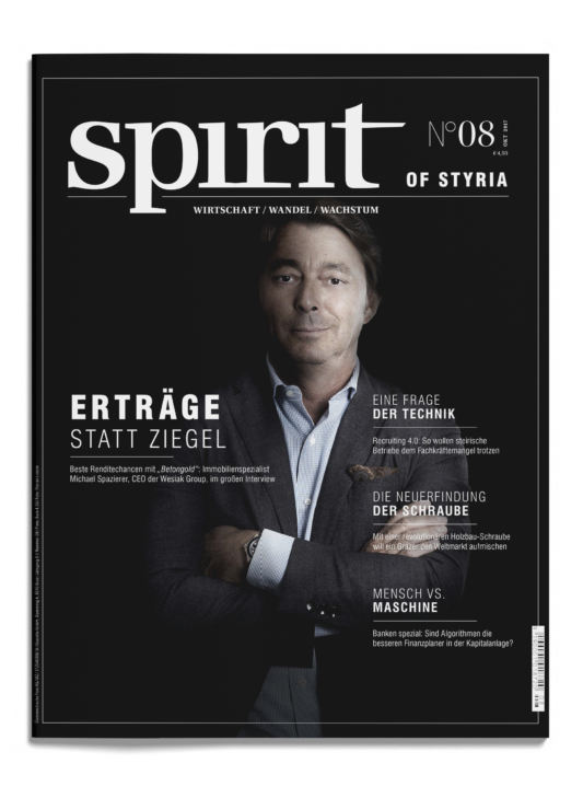 Titelbild des Magazins Spirit of Styria mit einem Mann im Anzug, verschränkte Arme, auf schwarzem Hintergrund. Deutsche Schlagzeilen über Wirtschaft, Technologie und Wachstum.